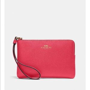 Coach poppy colored Wristlet
